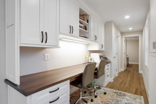 Basement Remodel basement office space area with two chairs and printer