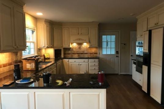 kitchen before remodel with dark counter tops