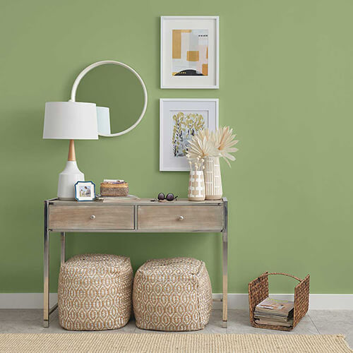 close up of side table with guacamole colored walls