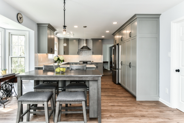 A beautiful modern kitchen leading into the rest of a home